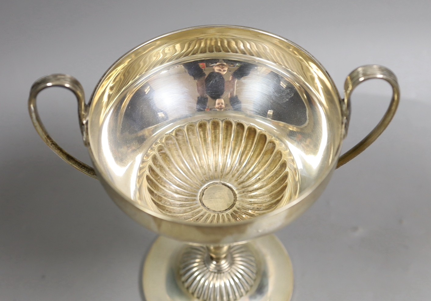 An Edwardian demi fluted silver two handled trophy cup, by Mappin & Webb, Sheffield, 1901, with later engraved horse racing inscription, height 20.1cm, 13.6oz.